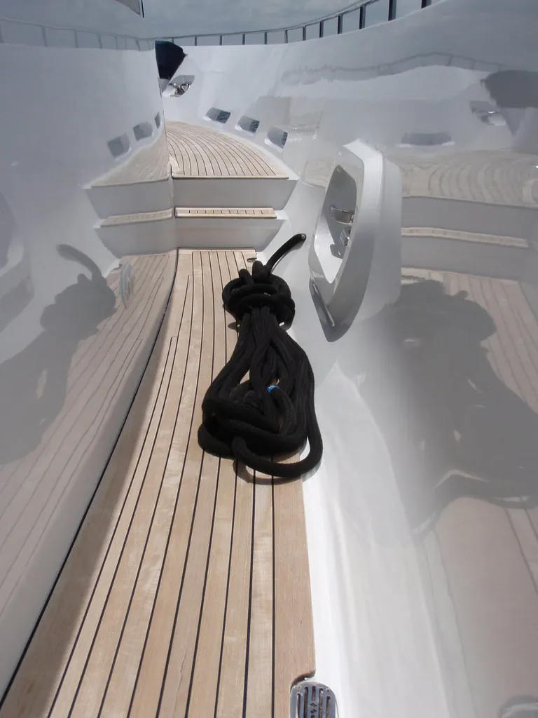 Immaculate polished surfaces and teak decking on a yacht